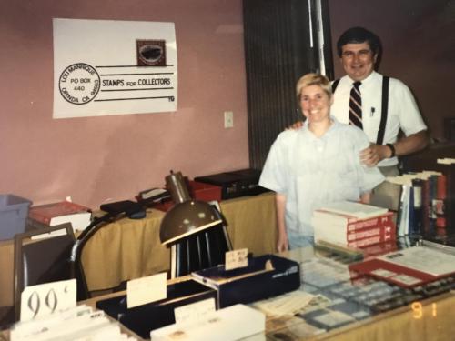 Arlene helping Lou sell stamps.